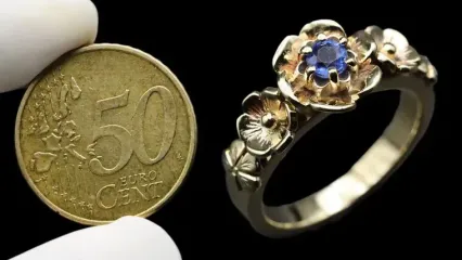(ویدئو) فرآیند تماشایی تبدیل کردن یک سکه 50 سنتی به انگشتر زنانه زیبا