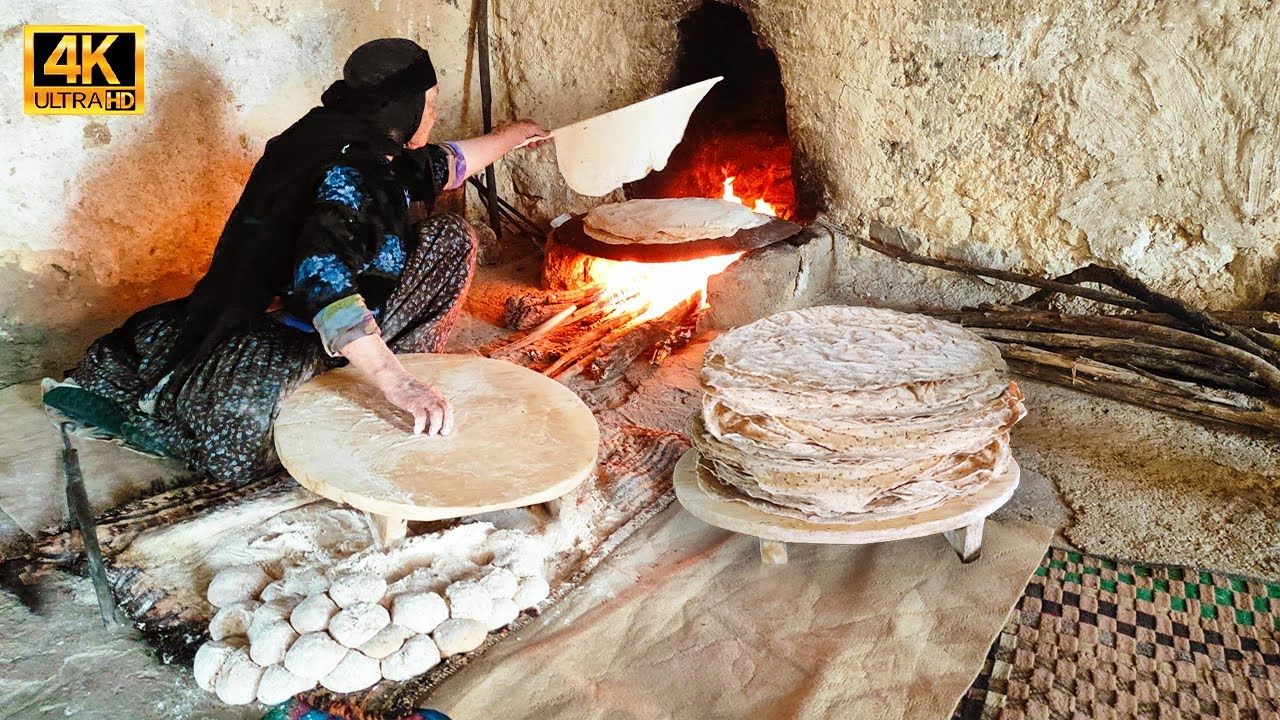 (ویدئو) پخت نان ساجی و ماهی سالمون کبابی به روش دیدنی بانوی عشایر قشقایی