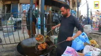 (ویدئو) غذای خیابانی در افغانستان؛ برش، پردازش و پخت صدها ماهی