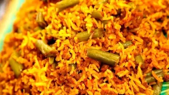 طرز تهیه لوبیا پلو مجلسی با گوشت و ته‌دیگ سیب‌زمینی (ویدئو)