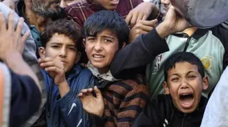 تصاویری دردناک از صف‌های طولانی غذا در غزه؛ به خاطر یک کاسه سوپ! + عکس