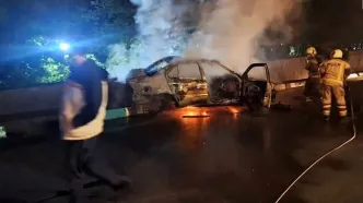 آتش سوزی خودرو بر اثر تصادف در بزرگراه همت