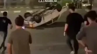 ببینید؛ لحظه دستی کشیدن و چپ کردن یک خودروی پیکان مقابل چشم مردم!
