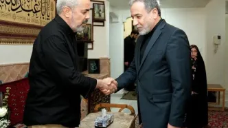 دیدار عراقچی با خانواده شهید محمد باقری +عکس