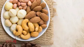 ماکادمیا بهتر است یا بادام؟ مقایسه‌ای جامع از دو آجیل پرطرفدار