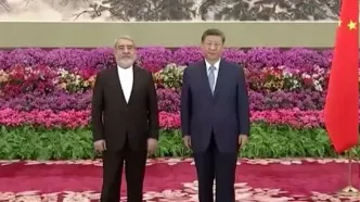 عبدالرضا رحمانی فضلی استوارنامه خود را تقدیم شی جی پینگ کرد