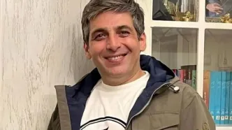 عکسی متفاوت از حمید گودرزی در سفر به هلند در کنار دوستش