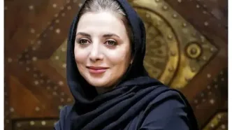 نوزادی رویا میرعلمی در آغوش پدرش