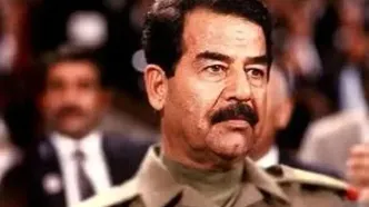 دهه ۷۰: مصطفی پورمحمدی در کنار صدام حسین