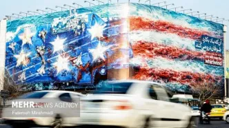 دیوارنگاره میدان ولیعصر با پرچم آمریکا و یک تهدید