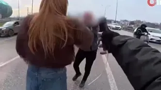 مداخله دختر جوان در درگیری فیزیکی وسط جاده!