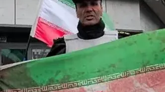 پرچم ایران آغشته به خون شهید روز قدس تهران شد + ویدئو