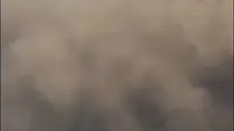 طوفان و دیواری از گرد و خاک هاربین چین را در تاریکی فروبرد