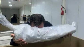 تصاویر تلخ از آماده‌سازی پیکر شهدای مدرسه میناب