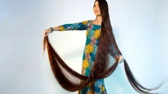زنی با موهای ۲.۷ متری رکورد گینس را شکست | عکس
