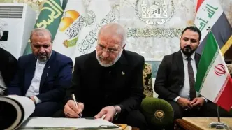 دست نوشته قالیباف در دفتر یادبود عتبه حسینی در کربلا