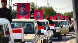 حشدالشعبی به مناسبت خروج آمریکا رژه پیروزی در بغداد برگزار کرد